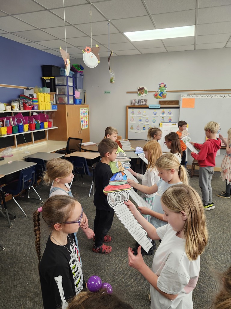 Reading to the 2nd grade students.