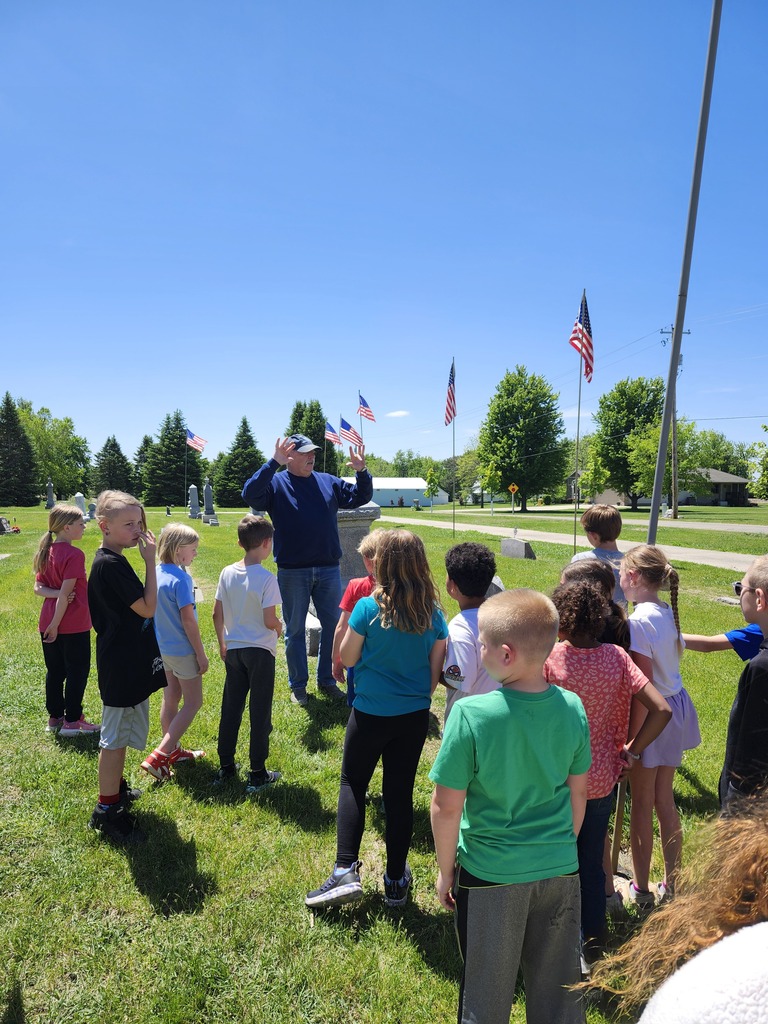 Marshall takes time to talk with kids about some special stones.