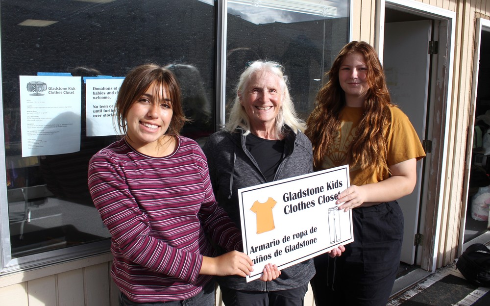 students volunteering at clothes closet