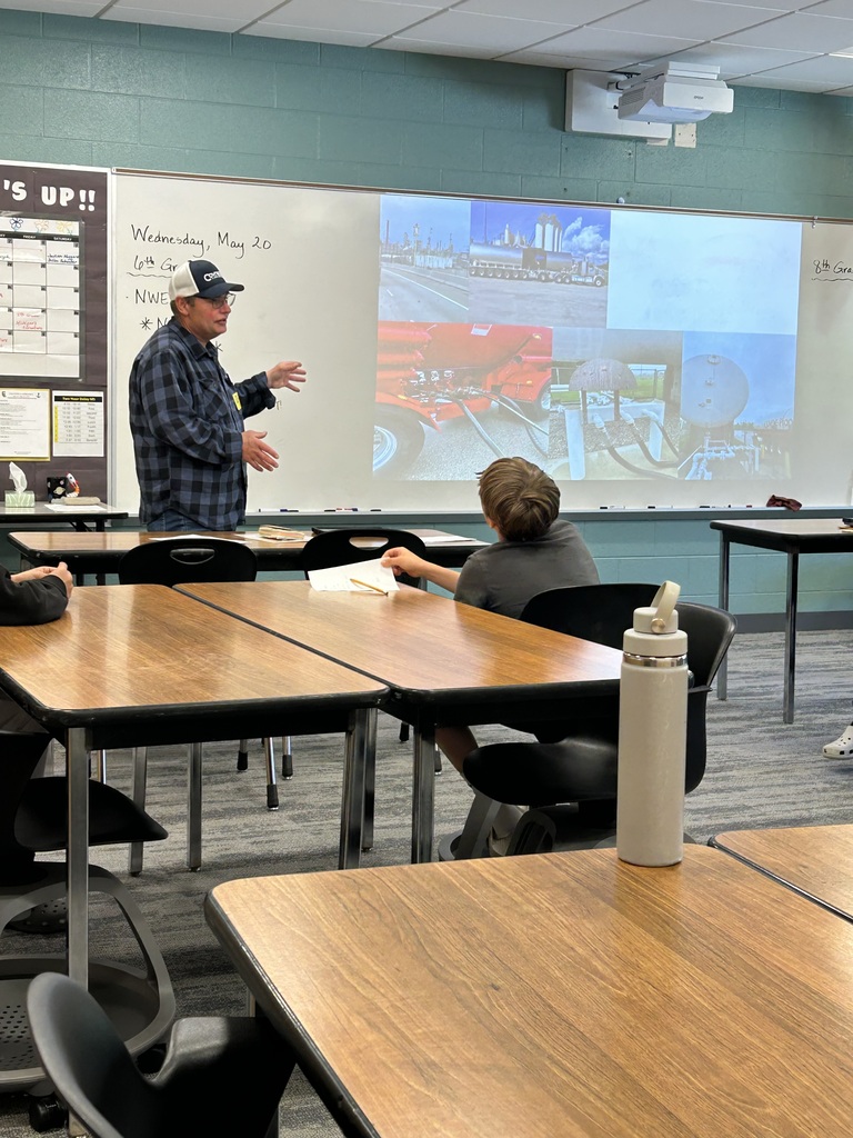 Mr. Widrig giving a presentation on his job at Coyne Oil to middle school careers students.