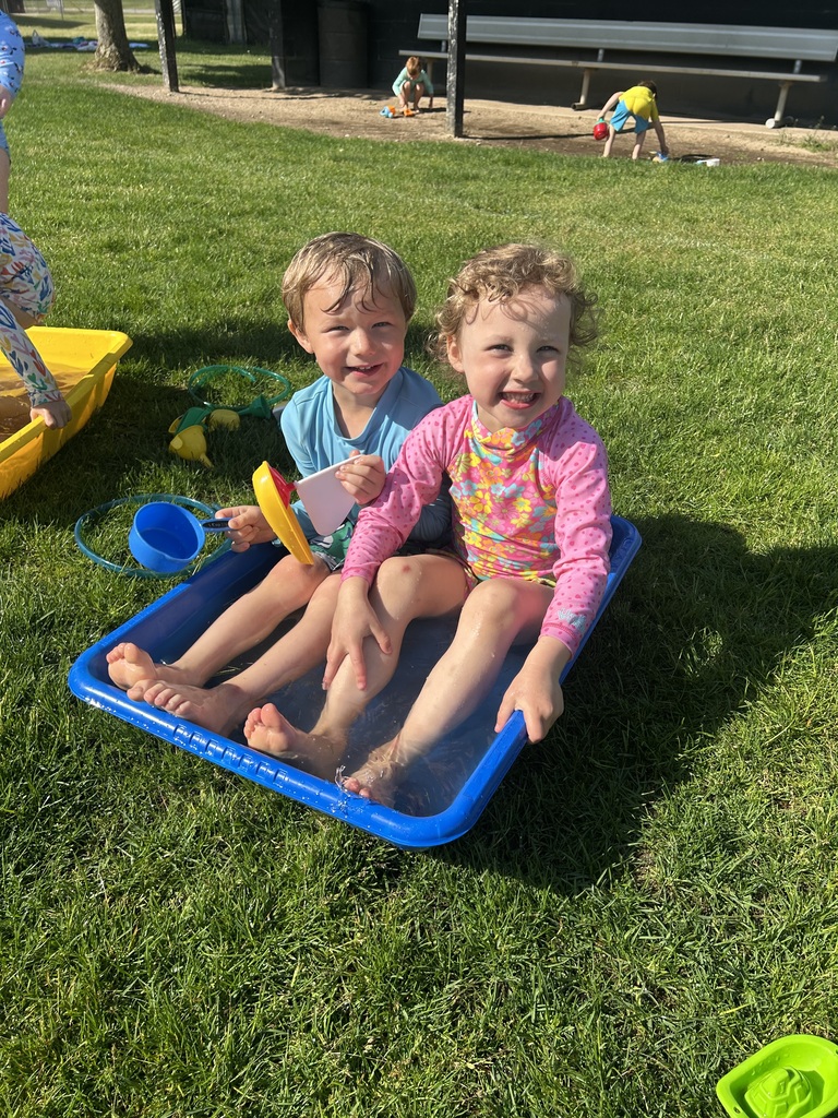Preschoolers soaking up sunshine and water