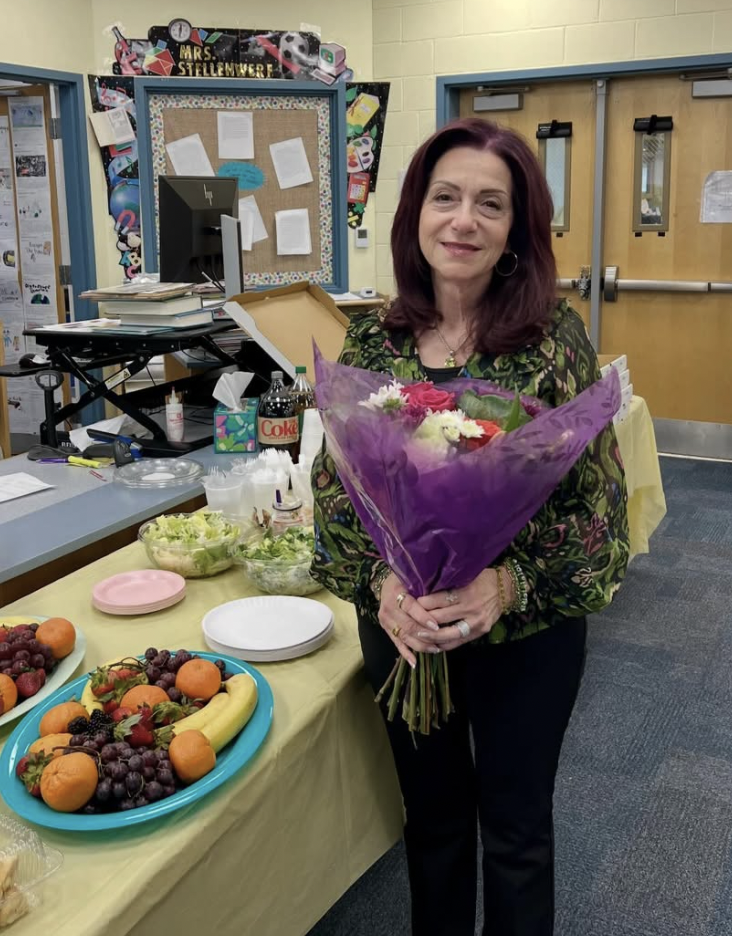 Mrs Marino with bouquet of flowers