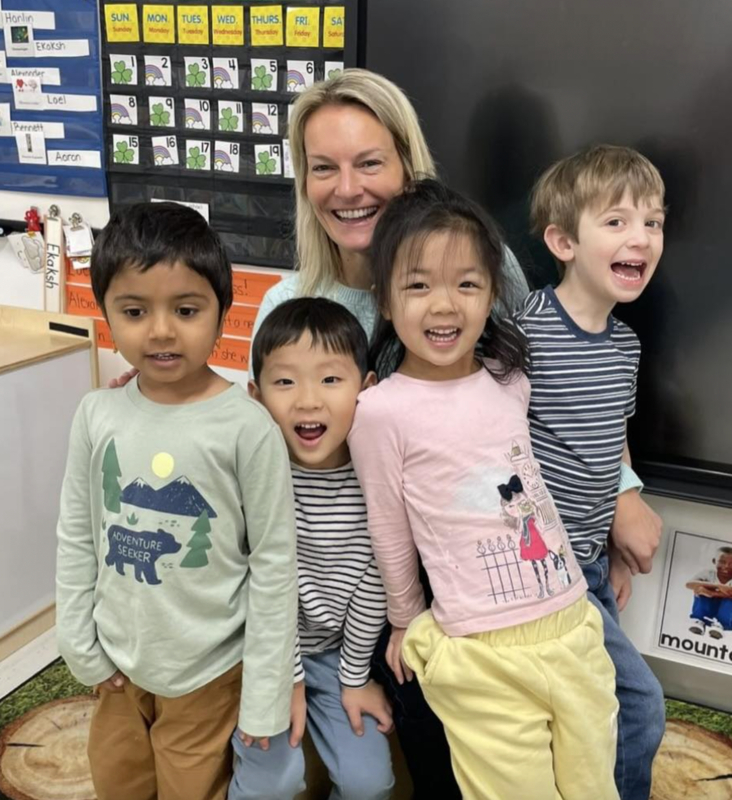 Jennifer MacKay with 4 ECP kids smiling