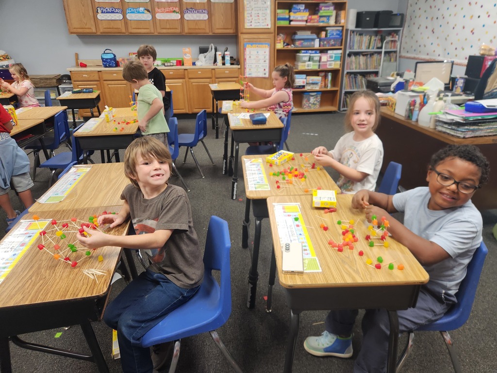1st graders trying to make the tallest tower out of Dots Candy and toothpicks. 
