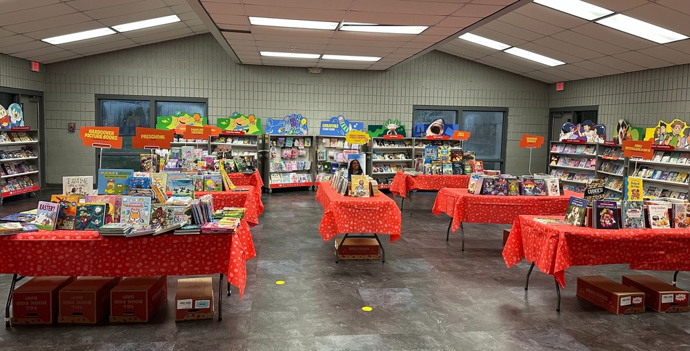 Books set up on tables for a book fair