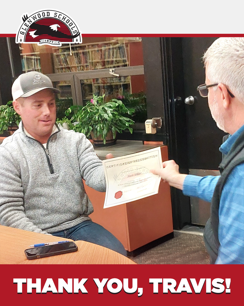 Photo of Travis Miller being presented with a certificate at a Glenwood school board meeting. The text "Thank you, Travis!" appears at the bottom of the image.