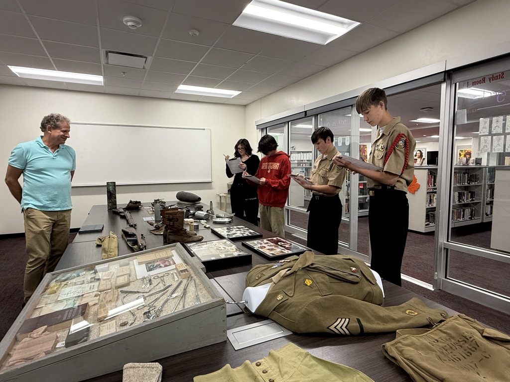 Mrs. Kathy Burns’ and Ms. Susan Sharps’ classes participated in a powerful Gallery Walk after reading Night by Elie Wiesel, exploring WWII and the Holocaust through artifacts, images, videos, music, and artwork.  A special thank-you to Mr. Jim Eccleston for sharing his collection, hosting a station, and taking student questions, and to Mrs. Wrenn Kibler and Mrs. Jessica North for hosting the event in the Library Media Center and helping make this meaningful learning experience possible.