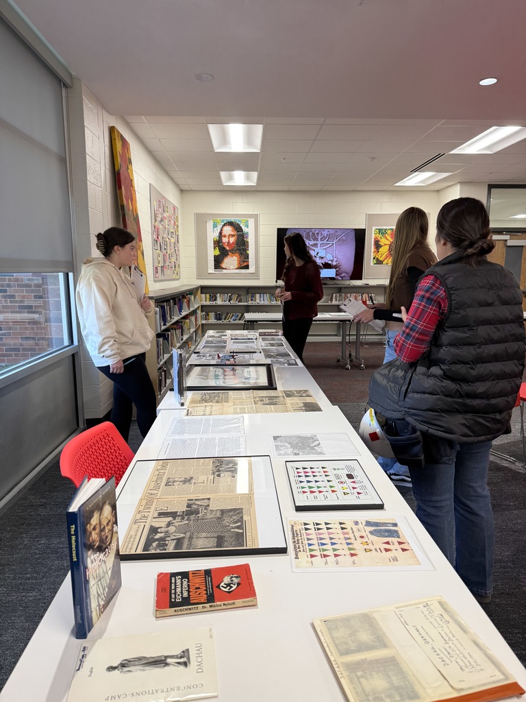 Mrs. Kathy Burns’ and Ms. Susan Sharps’ classes participated in a powerful Gallery Walk after reading Night by Elie Wiesel, exploring WWII and the Holocaust through artifacts, images, videos, music, and artwork.  A special thank-you to Mr. Jim Eccleston for sharing his collection, hosting a station, and taking student questions, and to Mrs. Wrenn Kibler and Mrs. Jessica North for hosting the event in the Library Media Center and helping make this meaningful learning experience possible.