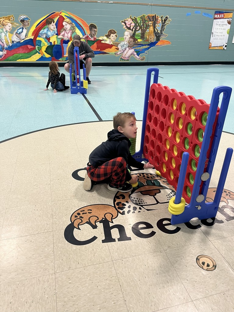 Student playing Connect 4 at Champ's Reading Patch