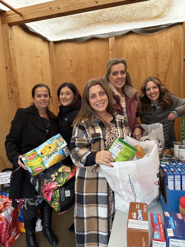Photo of teachers with food donations