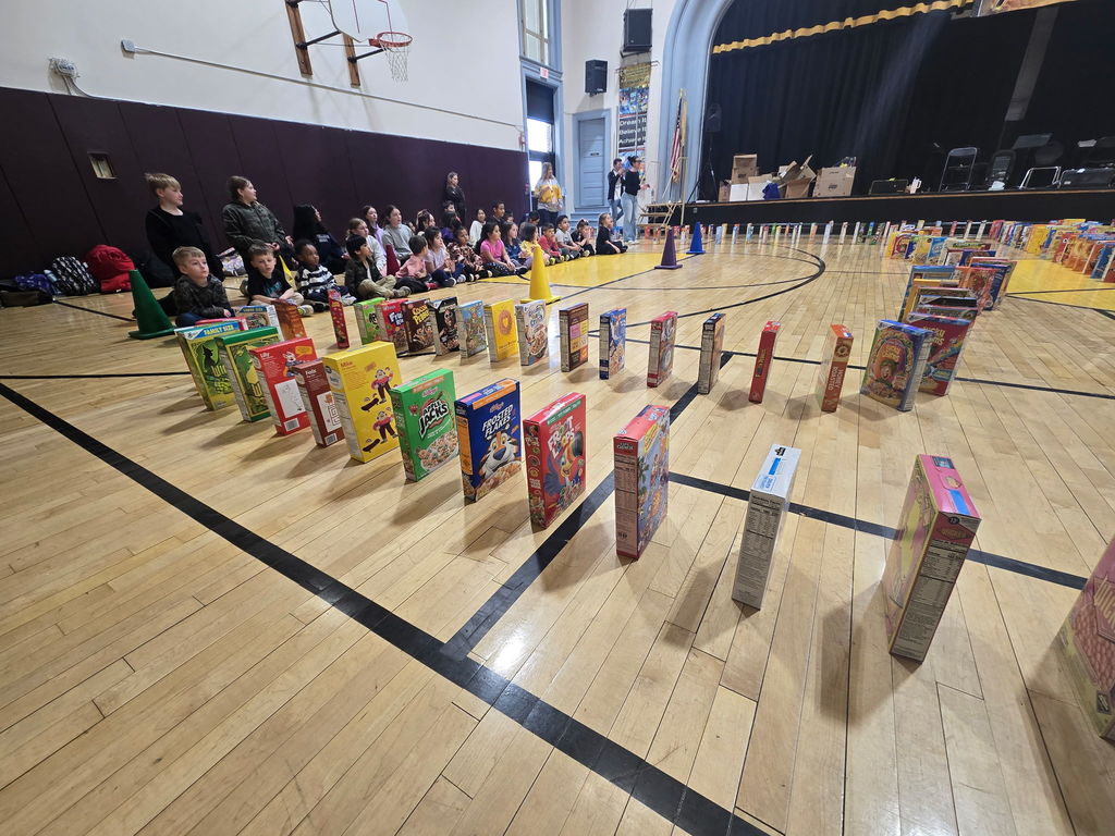 Cereal boxes falling like dominos.