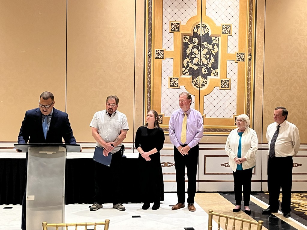 Photo of Ms. Kim with Mr. Mercado, Mr. Graziano, Mr. Bilodeau, Ms. Johnson, and Mr. Pildis