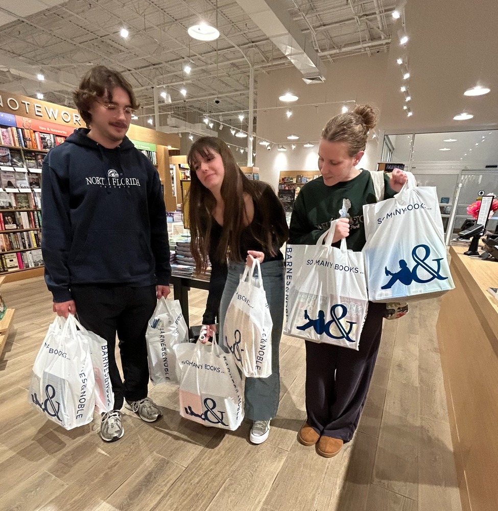 GHS National Honor Society checks out with books for kids at Christmas.