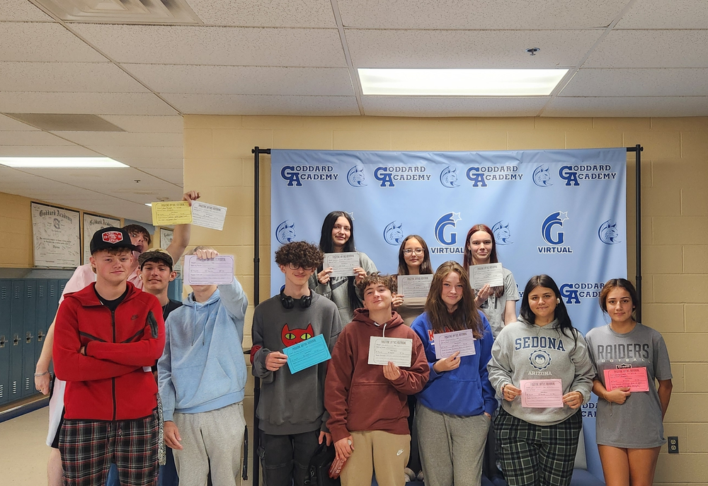 Students with Positive Office Referral papers and candy