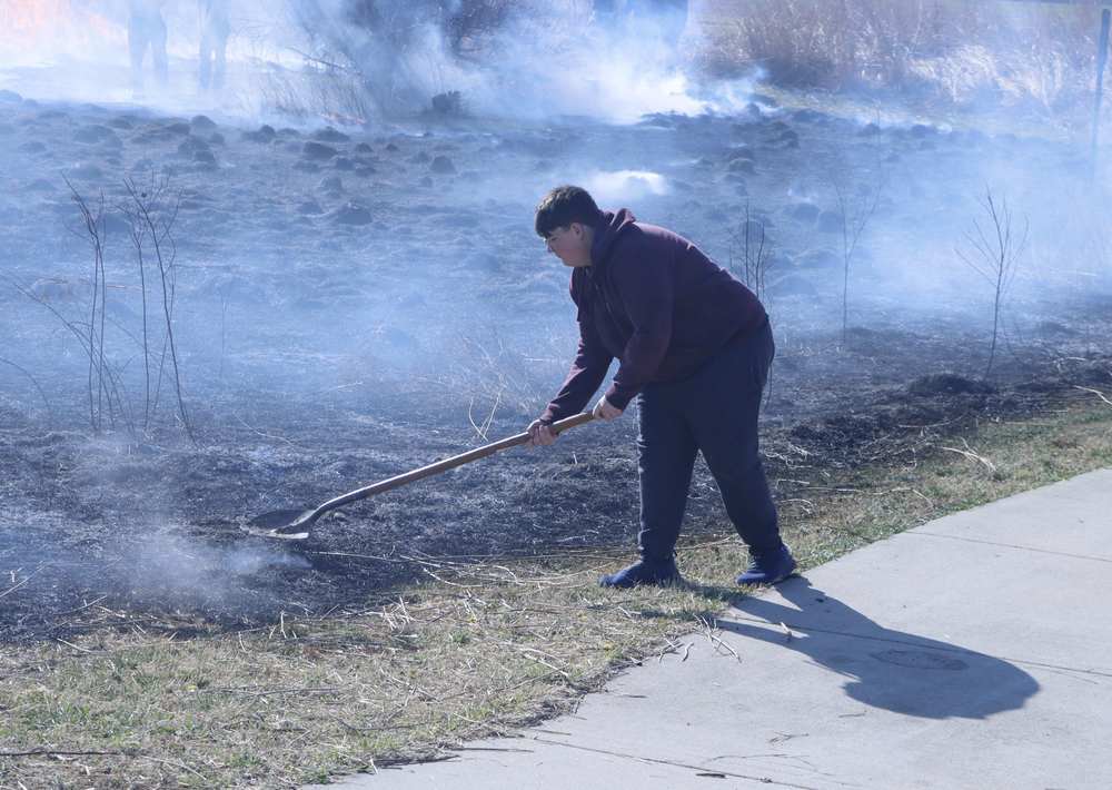 GHS Students and faculty moniter the annual burn off of the OWLS nature site.
