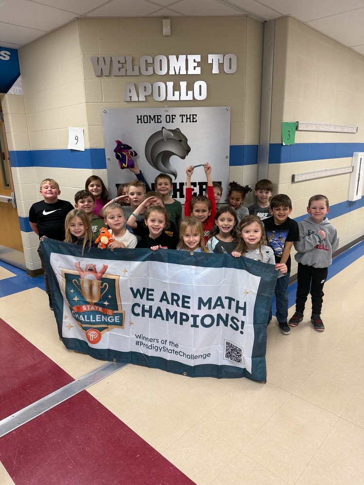 Mrs. Schardin's 1st grade class with state championship banner. 