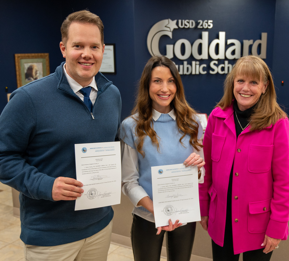 Shane Ewing & Lindsay White stand alongside Laura Rainwater (Sedgwick County Election Commissioner) after being sworn in as the newest members of the USD 265 Board of Education