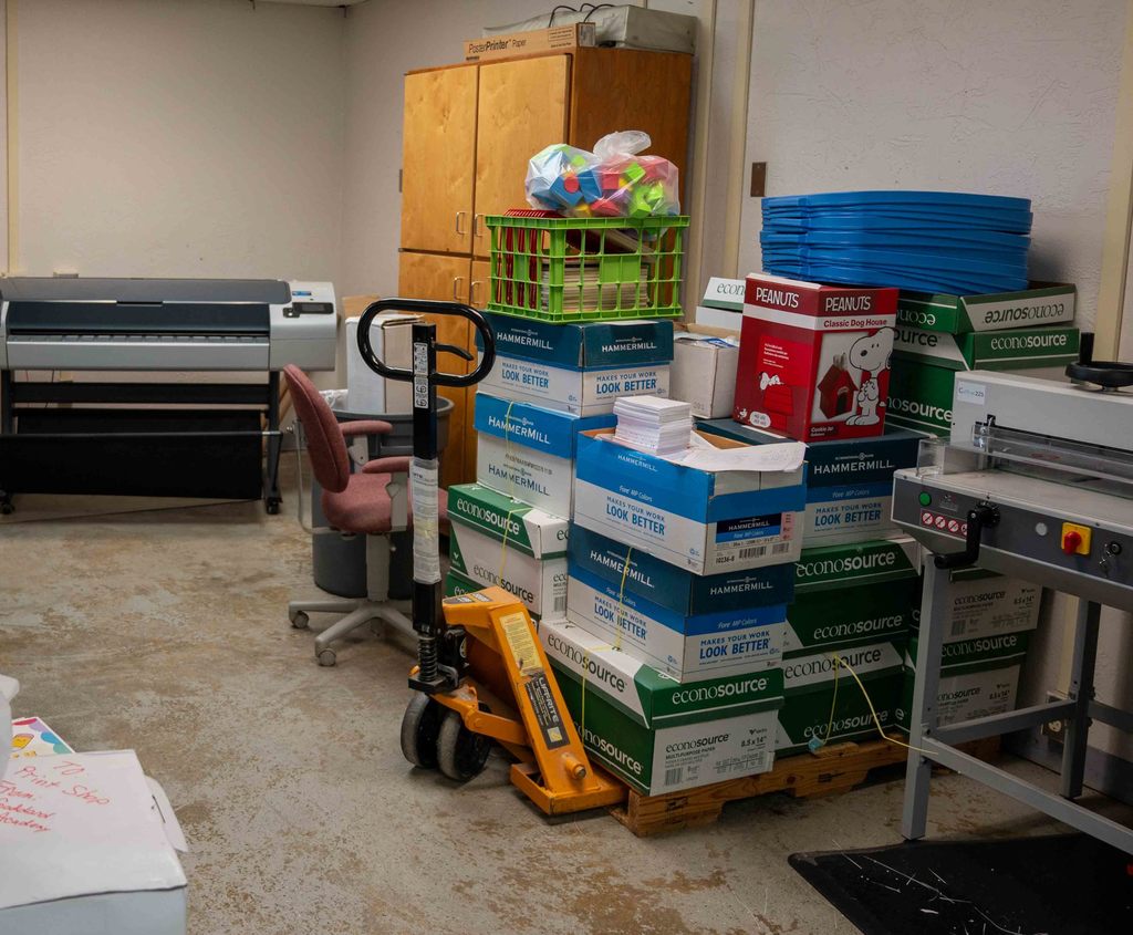 Print shop paper boxes on a pallet jack