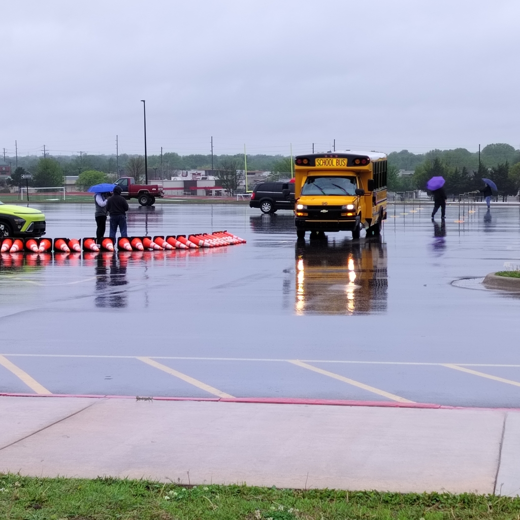 School bus in a rainy parking lot