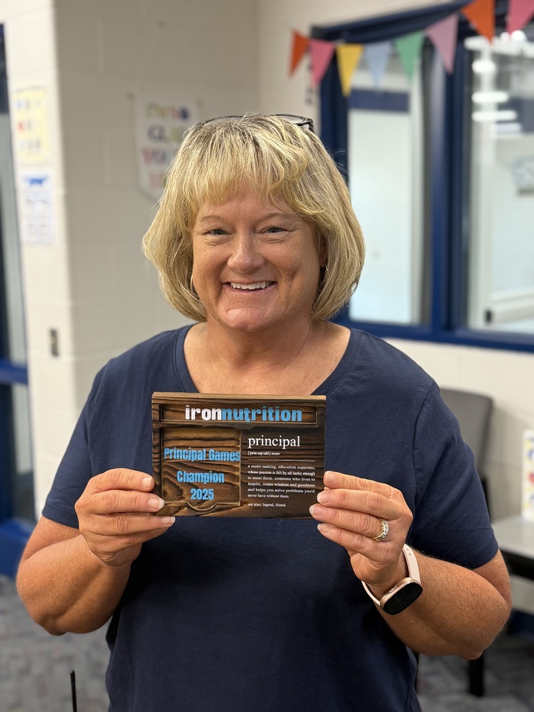 mrs.  hay holding the iron nutrition principal games wining plaque