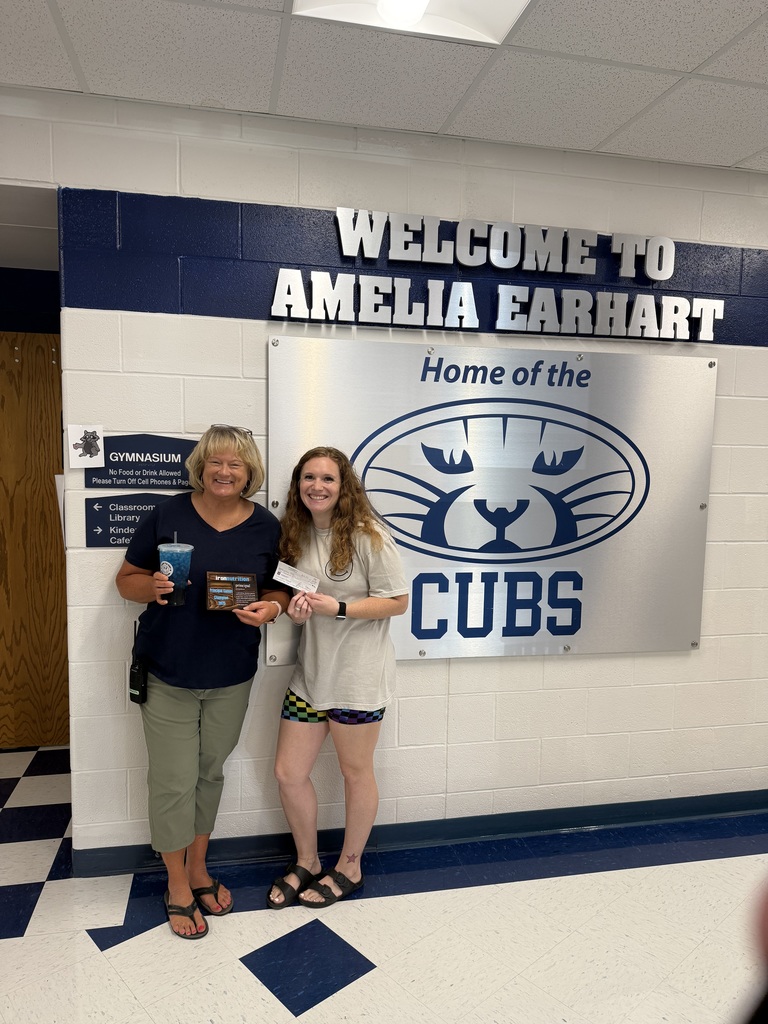 principal hay and jess with iron nutrition posing with the check and plaque