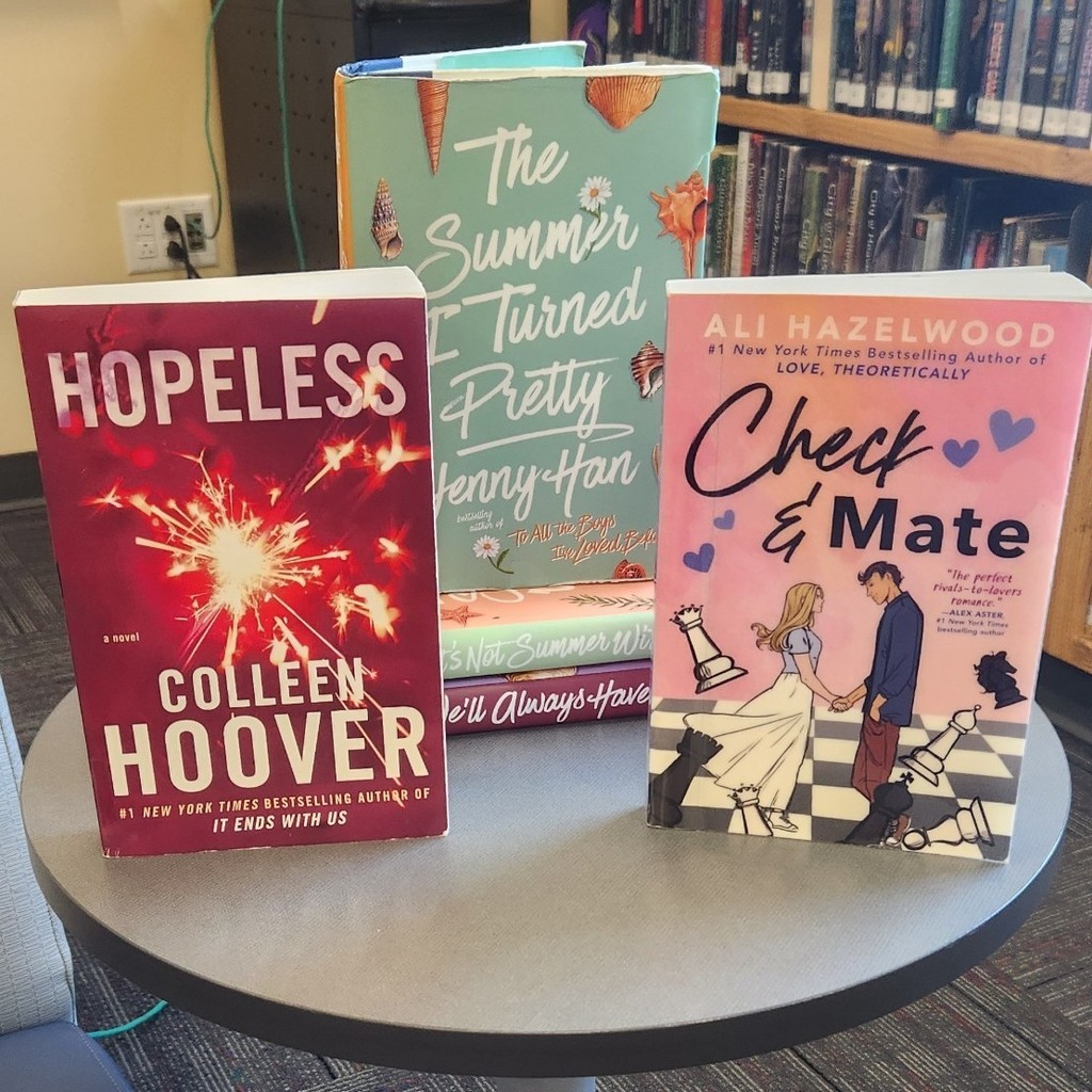 Display of Romance Books: Hopeless; Check & Mate; The Summer I Turned Pretty