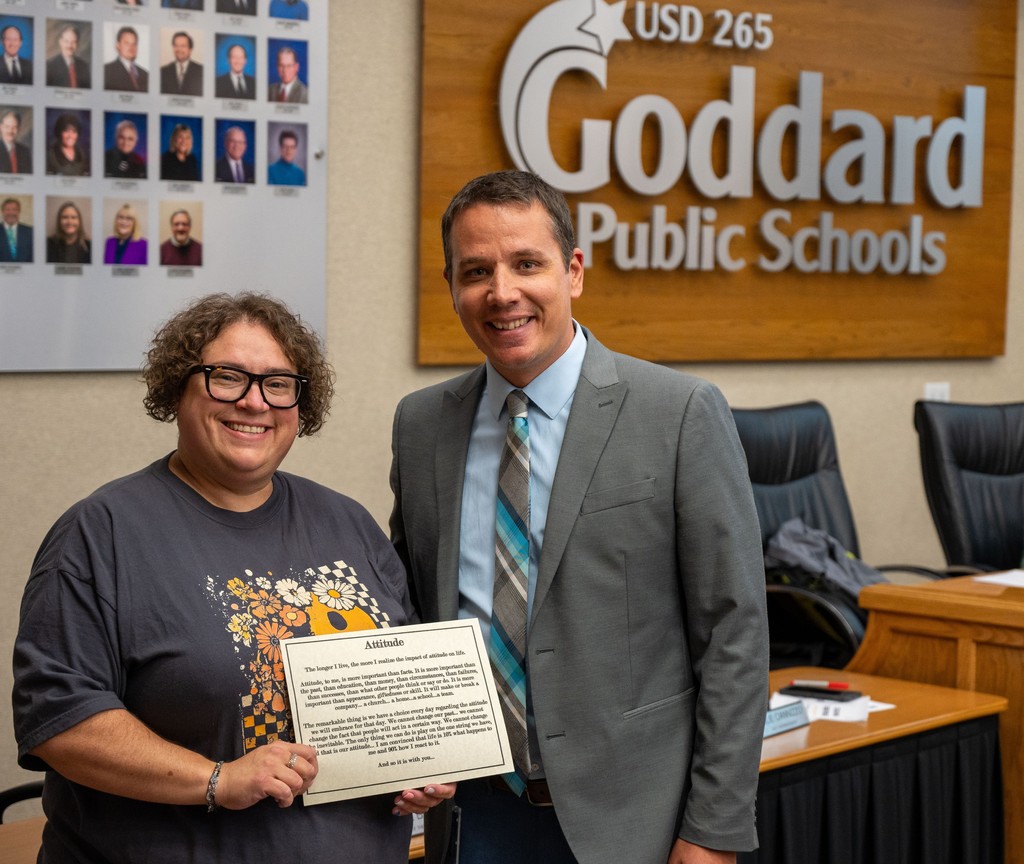 Nina Gracy receives the District Attitude Award from the USD 265 Board of Education