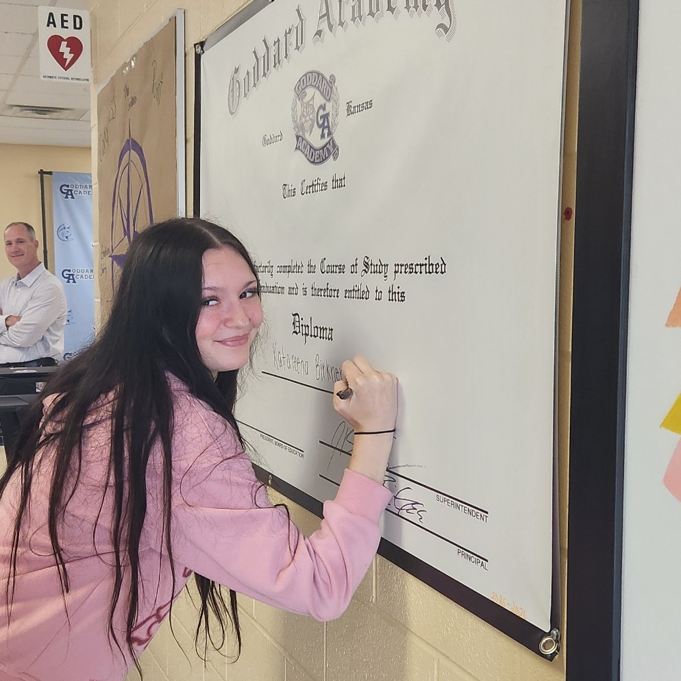 signing diploma