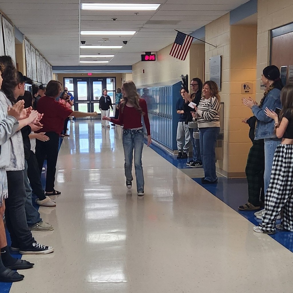 Walking down hall giving fist bump