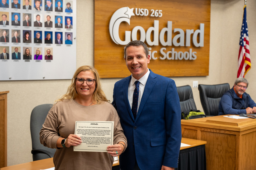 Stephanie Espinoza receiving the District Attitude Award (standing along Nick Grummert) at the October 2025 USD 265 Board of Education meeting