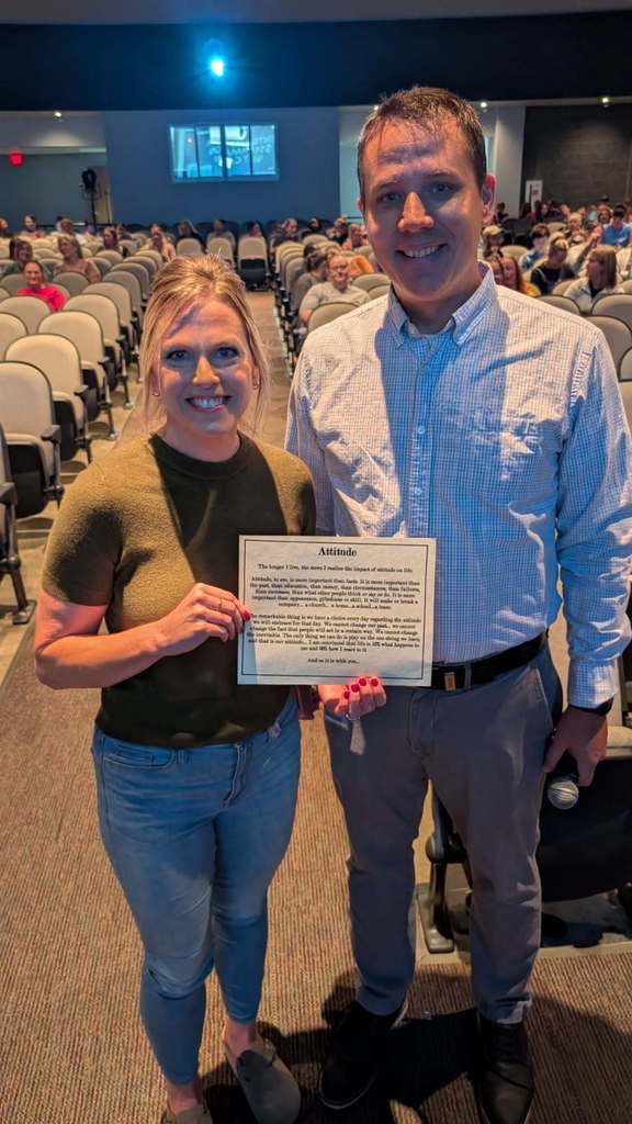 Laura Bakker receiving the District Attitude Award (standing along Nick Grummert)