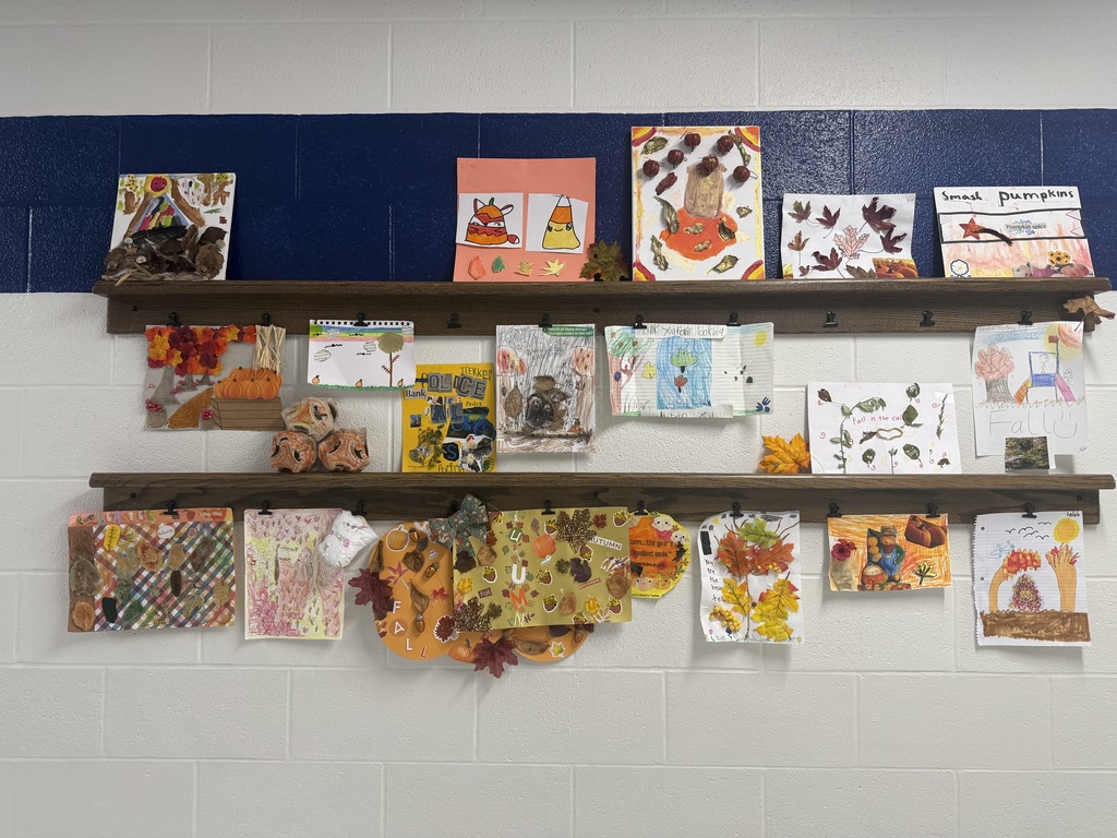 Photograph of a bunch of fall artwork displayed on shelves