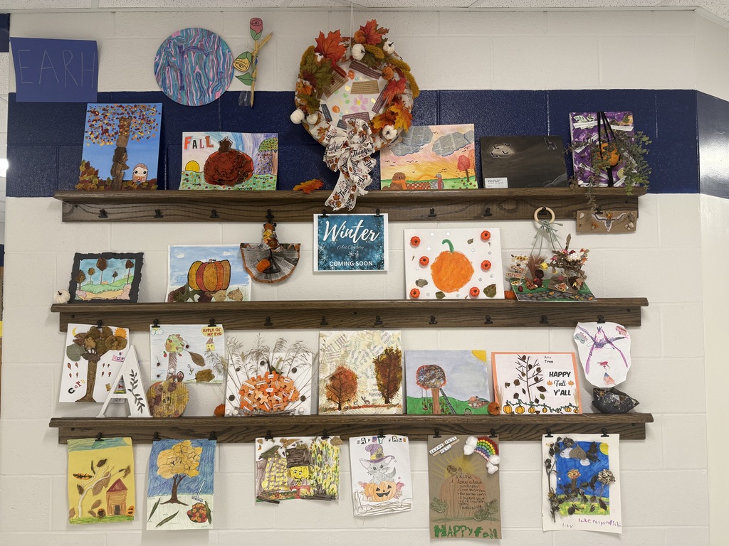 Photograph of a bunch of fall artwork displayed on shelves