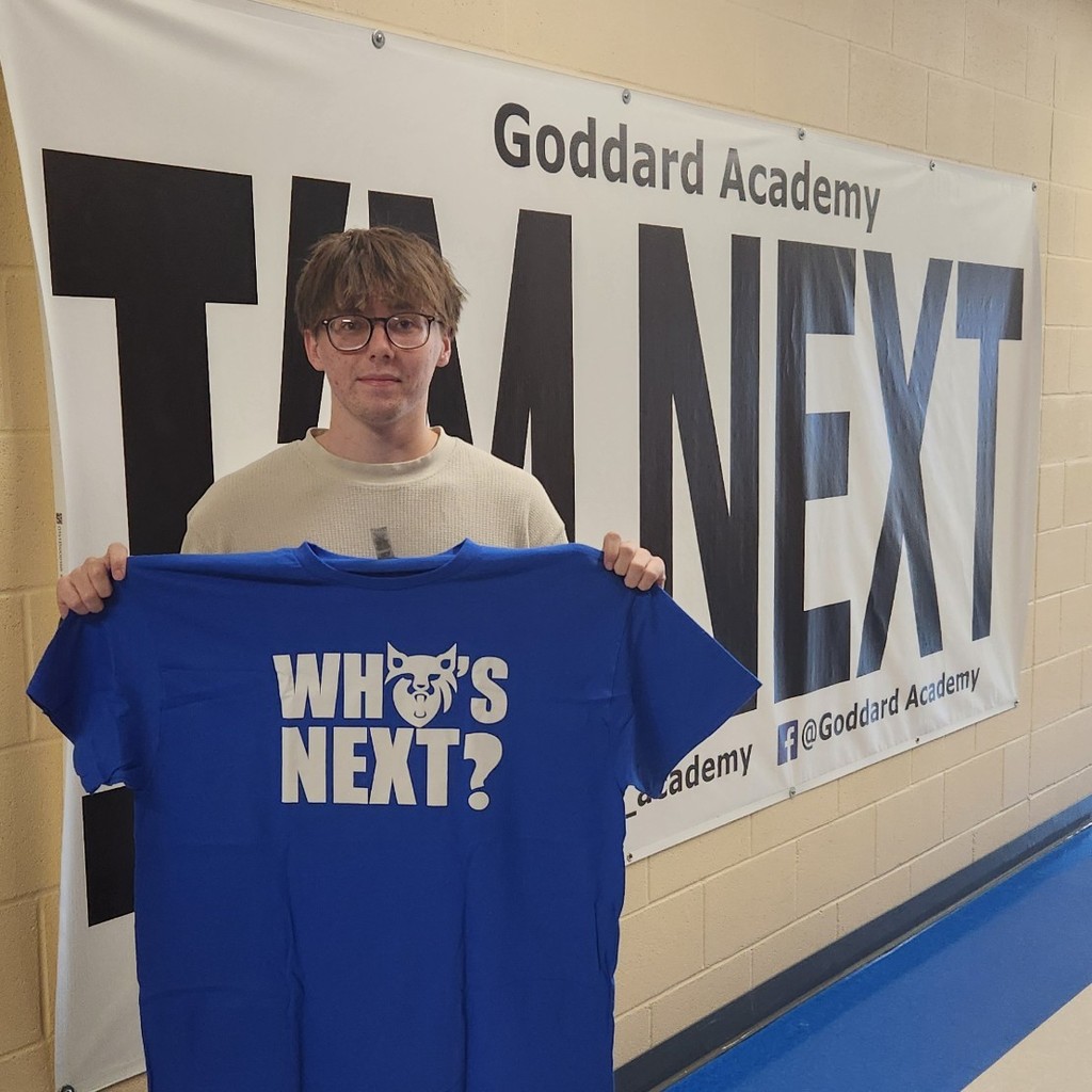 Holding "im next" in front of "whos next" banner