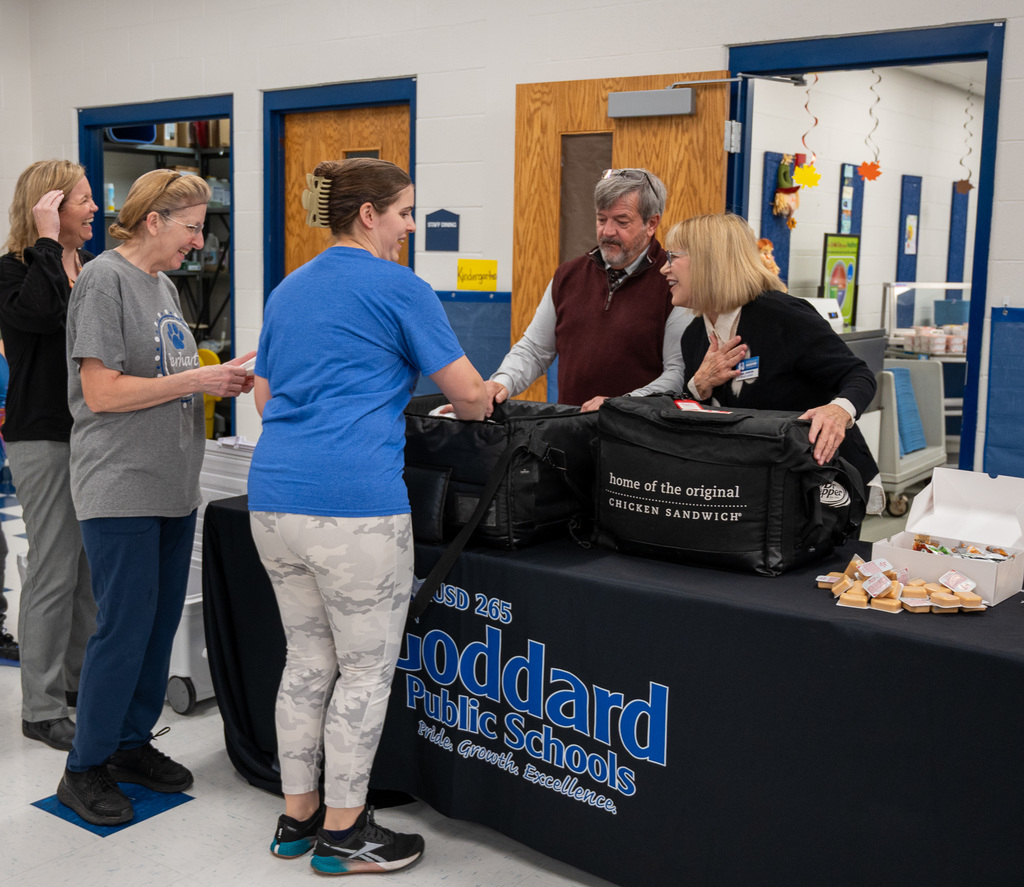 Goddard Education Foundation Trustees serve breakfast to USD 265 staff