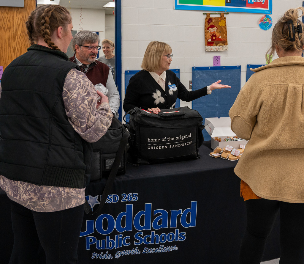Goddard Education Foundation Trustees serve breakfast to USD 265 staff