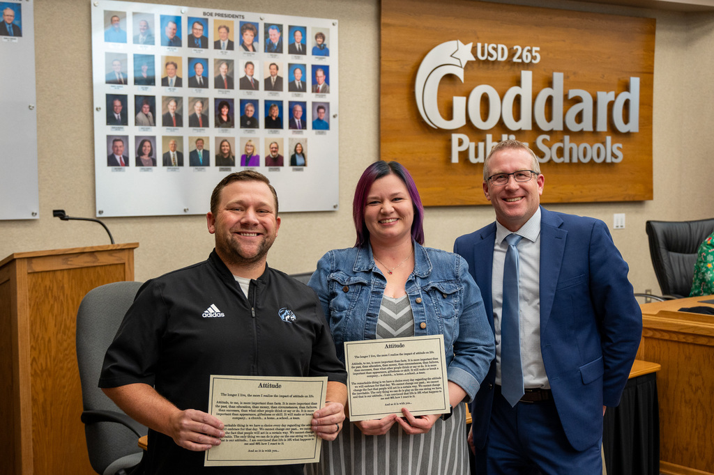 Russell Fluty & Jacque McLain receive the District Attitude Award from the USD 265 Board of Education