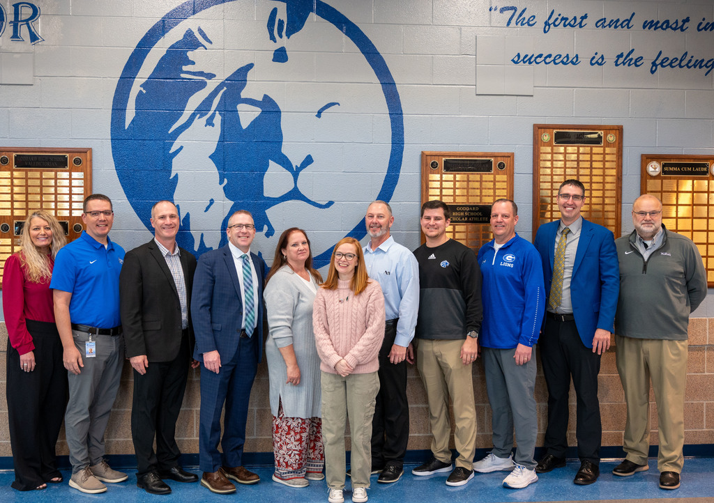 Goddard High School and district administrators pose with 2026 Horizon Award Winner Abbie Griffith