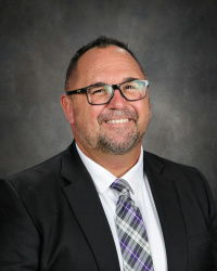 Picture of Tony Douglas with gray background