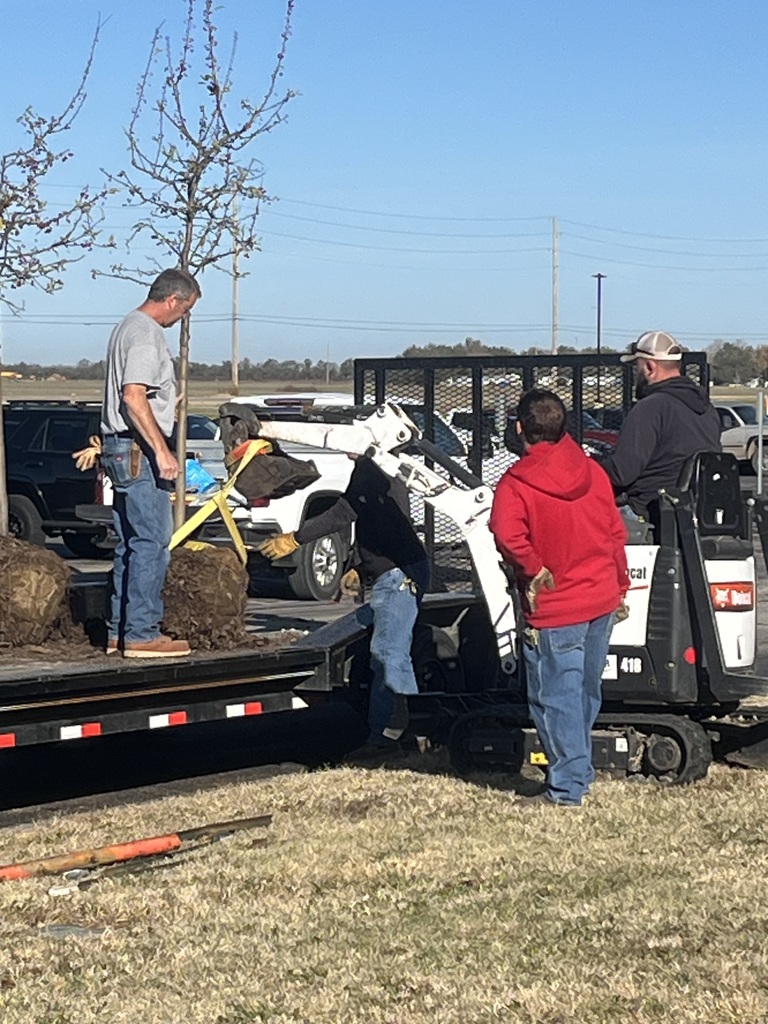 USD 265 Maintenance workers planting trees around the district