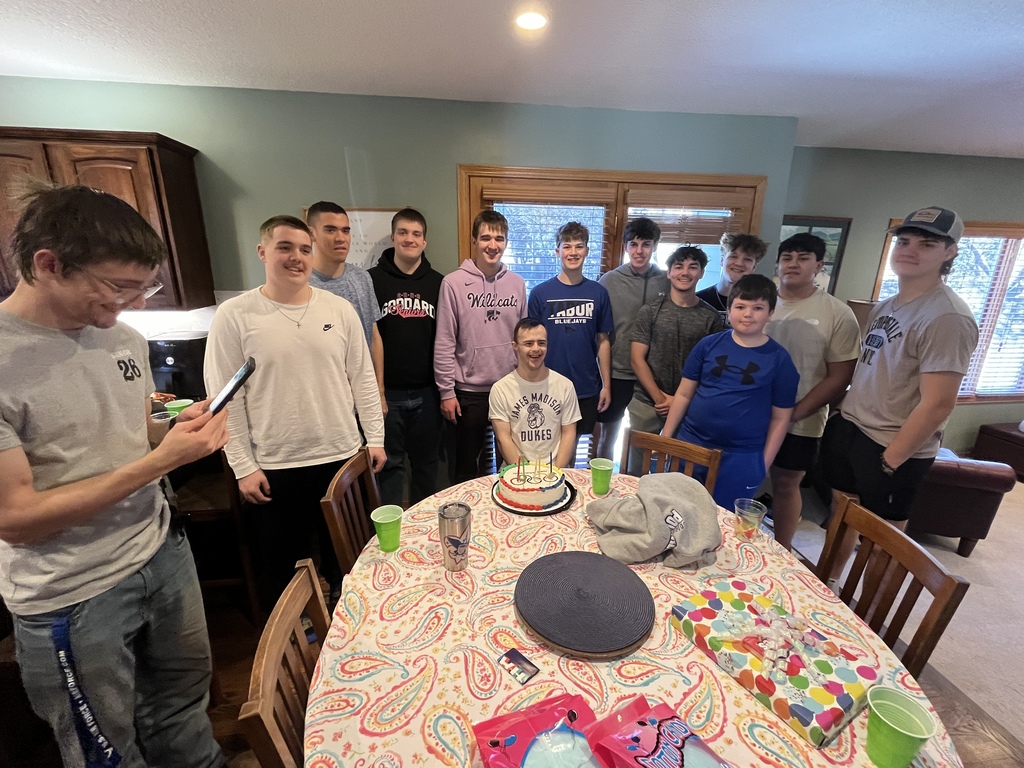 Several of James's friends gather around him at his recent birthday celebration