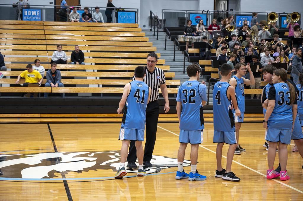 James Rohleder shakes the referee's hand before the EHS Unified Basketball game