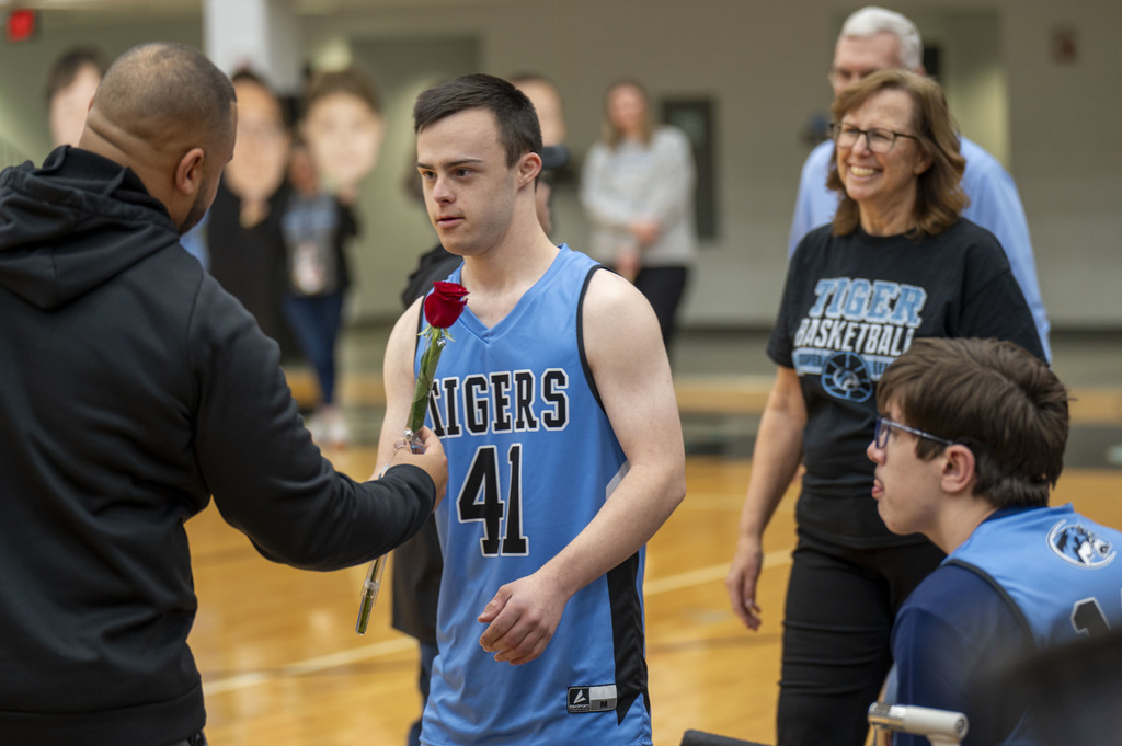 James Rohleder and his parents are recognized on senior day, before the EHS Unified Basketball game