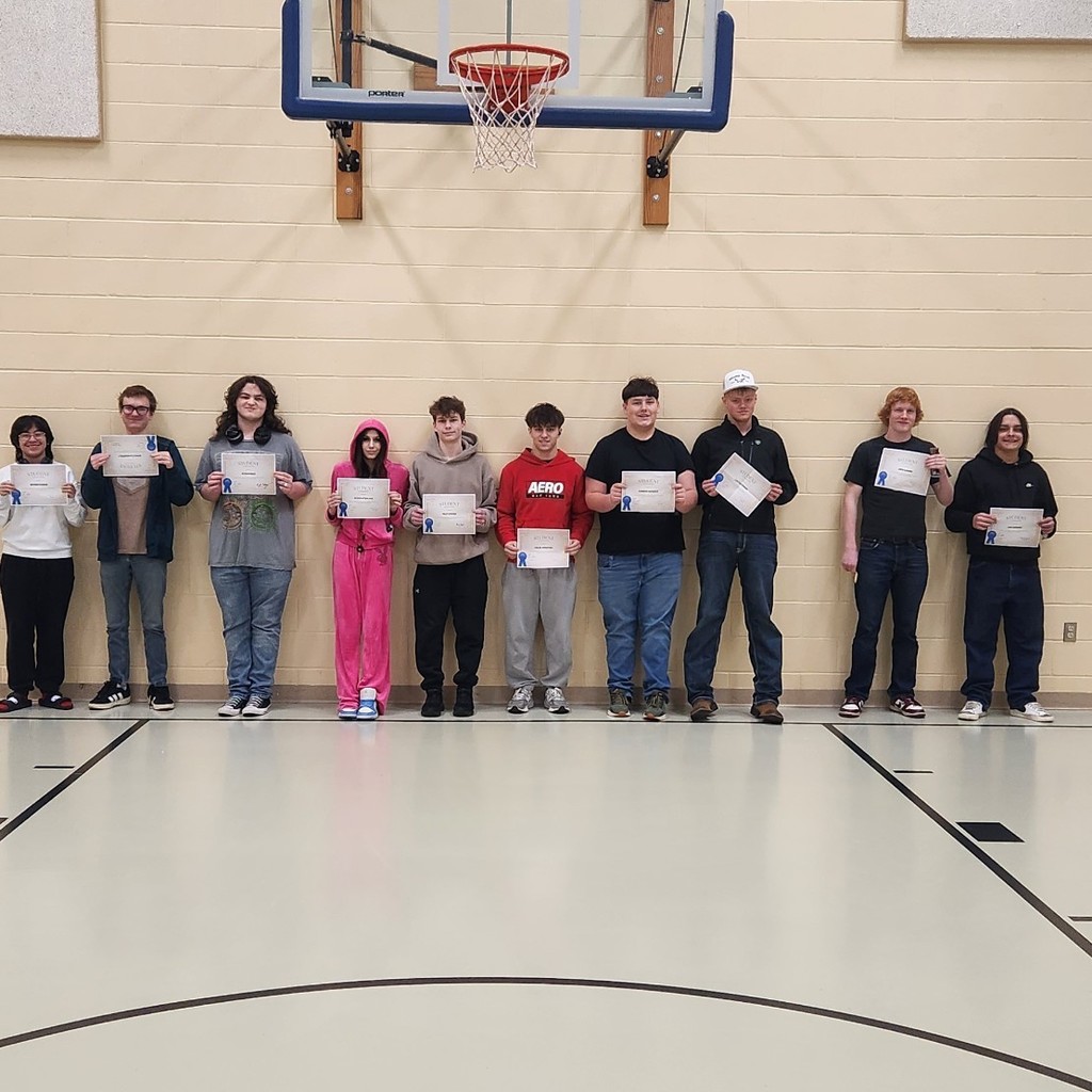 students of the month holding certificates
