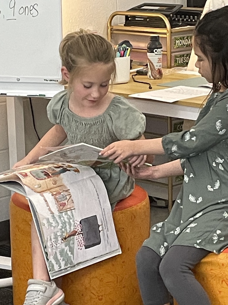 Mrs. H.’s class enjoyed some quiet time reading books enjoying the sunshine. 