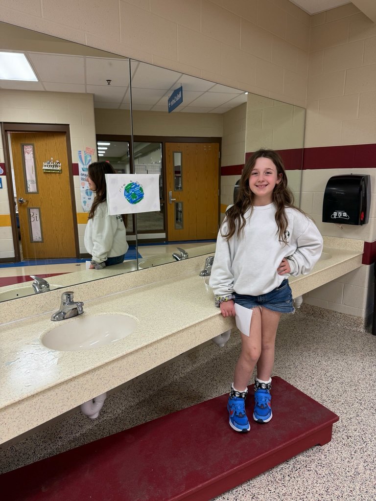 eloise with her earth day poster