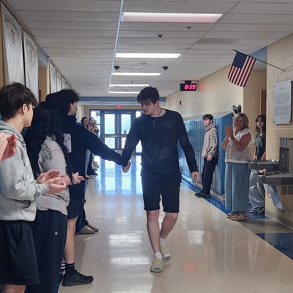Corbin Thompson lookin cool walkin down the hall