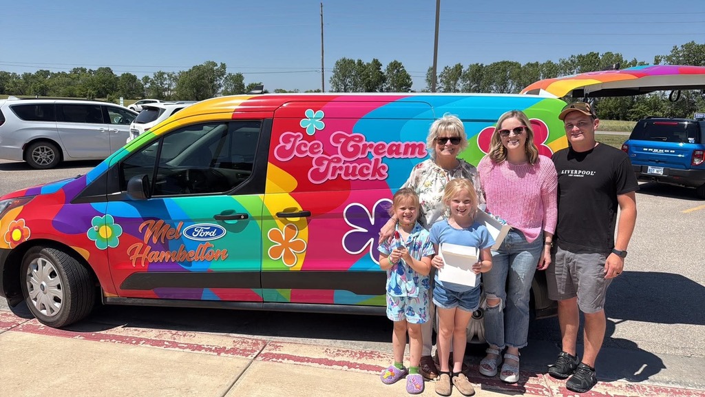 A colorful ice cream truck with floral designs and "Ice Cream Truck" text is parked. Five smiling people, including children, stand in front, conveying joy.