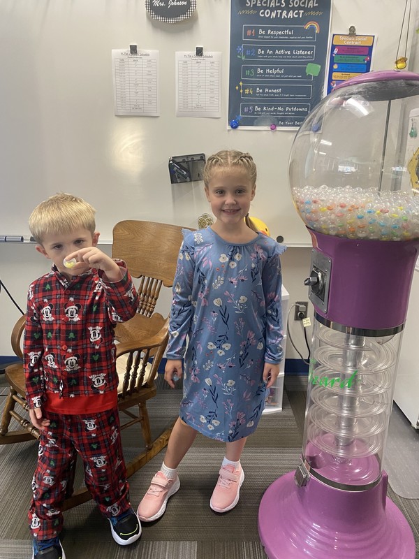 Kids holding up a gumballKids holding up a gumball