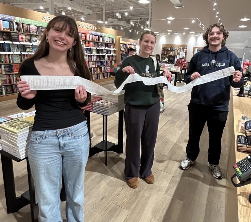 GHS National Honor Society checks out with books for kids at Christmas.